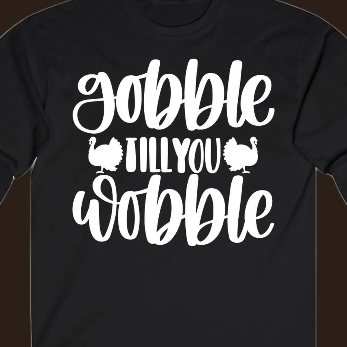 Gobble till you wobble text with turkey illustrations, Thanksgiving design.