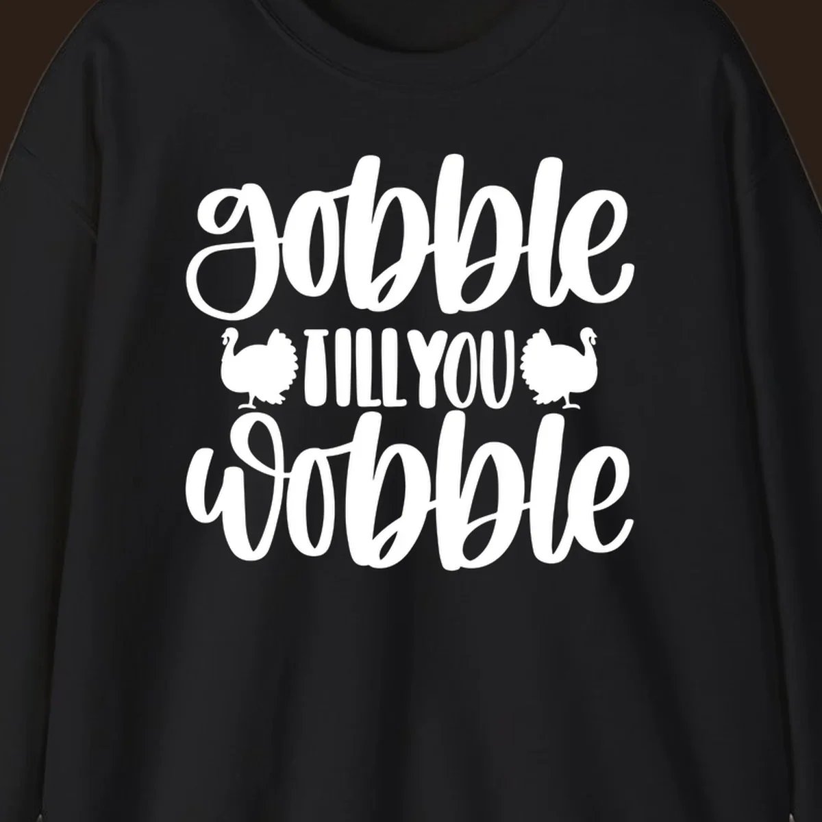 Gobble till you wobble text with turkey illustrations, Thanksgiving design.