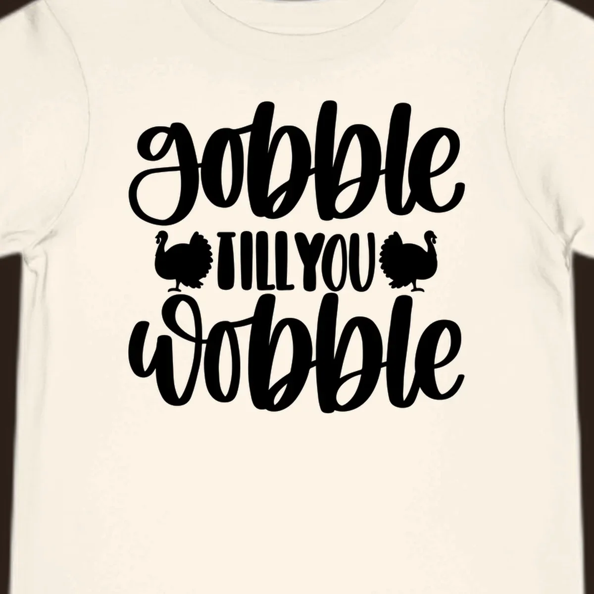 Gobble till you wobble text with turkey illustrations, Thanksgiving design.