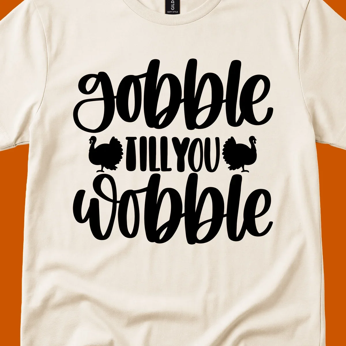 Gobble till you wobble text with turkey illustrations, Thanksgiving design.