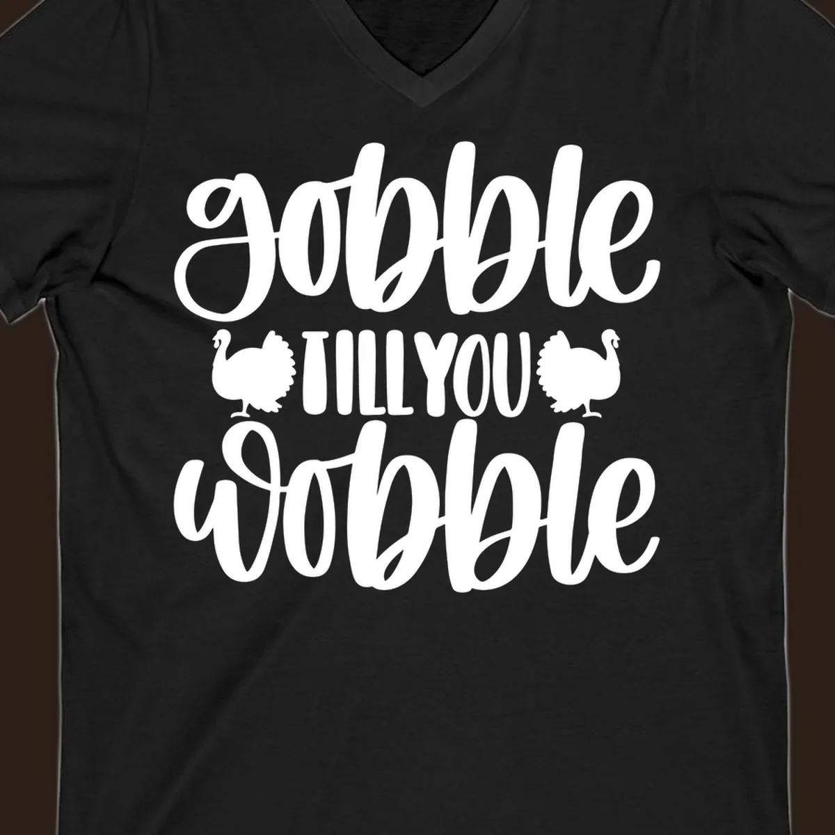 Gobble till you wobble text with turkey illustrations, Thanksgiving design.