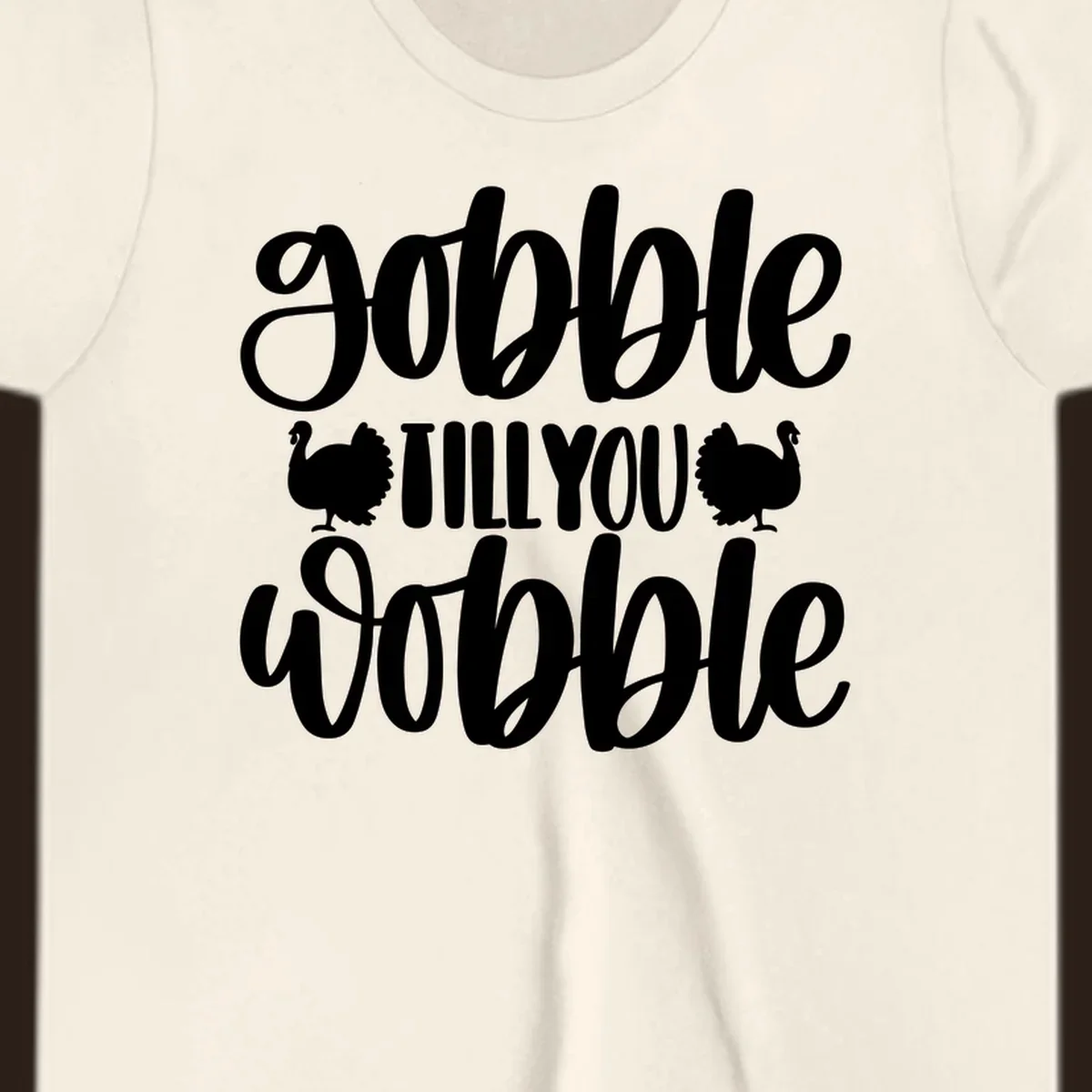 Gobble till you wobble text with turkey illustrations, Thanksgiving design.