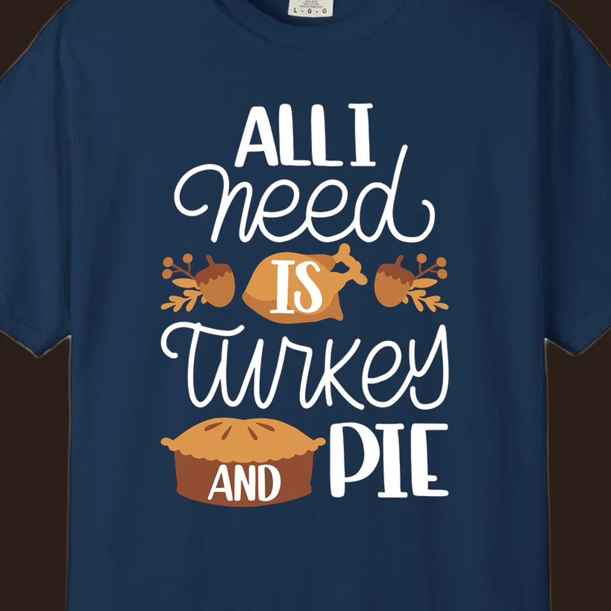Typography design with illustrations of turkey, pie, and acorns, saying 'ALL I NEED IS TURKEY AND PIE'.