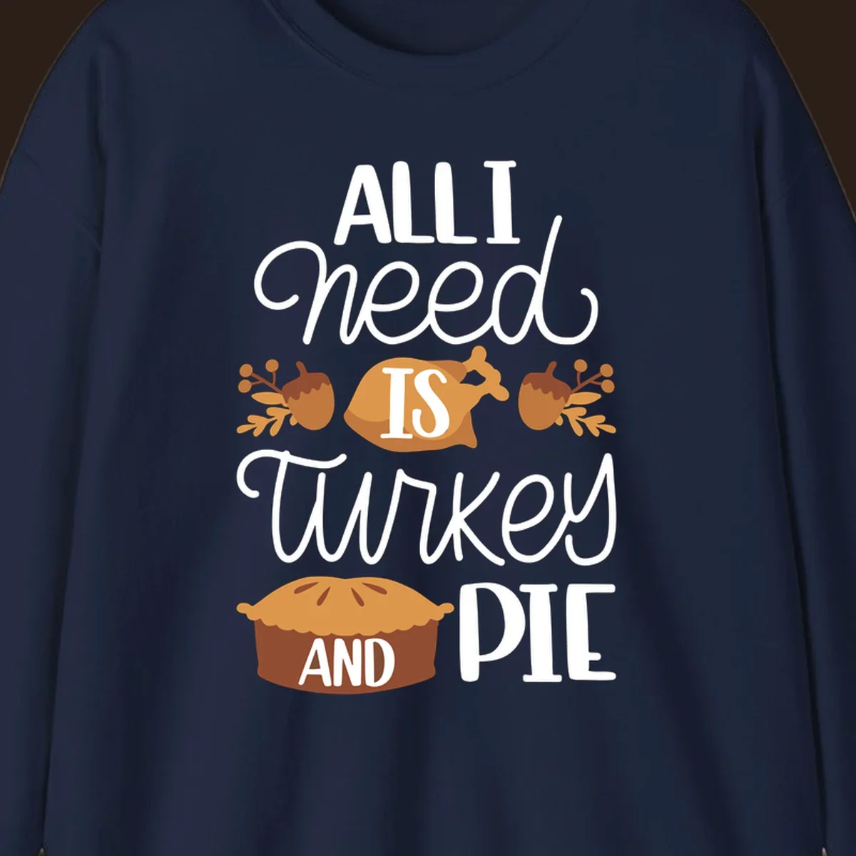Typography design with illustrations of turkey, pie, and acorns, saying 'ALL I NEED IS TURKEY AND PIE'.
