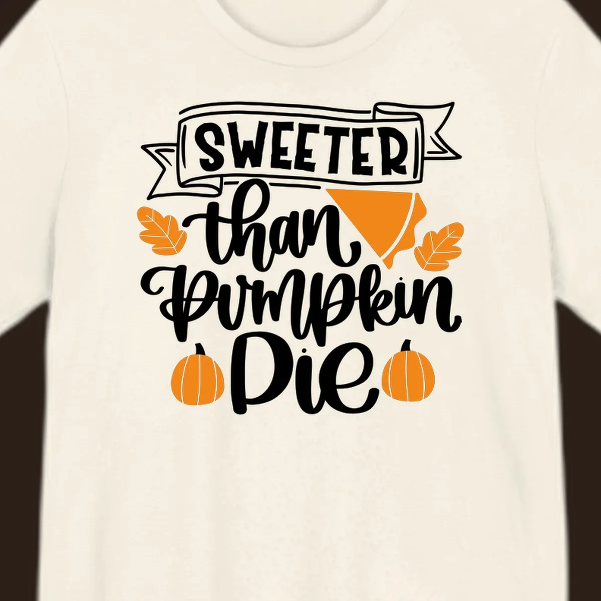 Sweeter than pumpkin pie thanksgiving design with text, pie slice, leaves, and pumpkins.