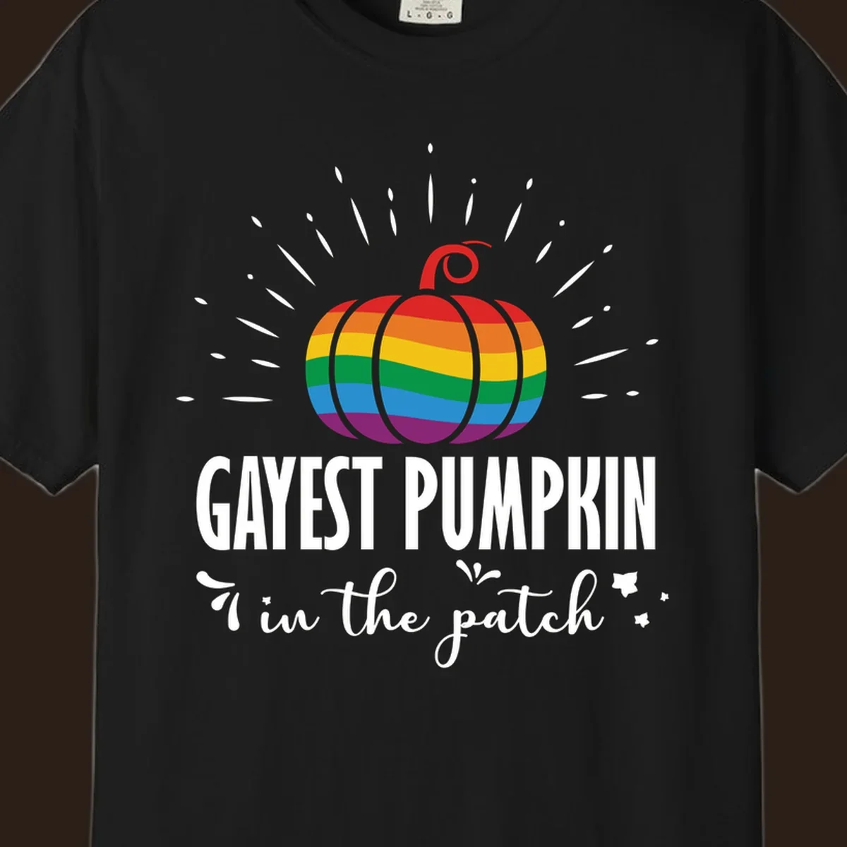 Gayest pumpkin in the patch design with rainbow pumpkin and text.