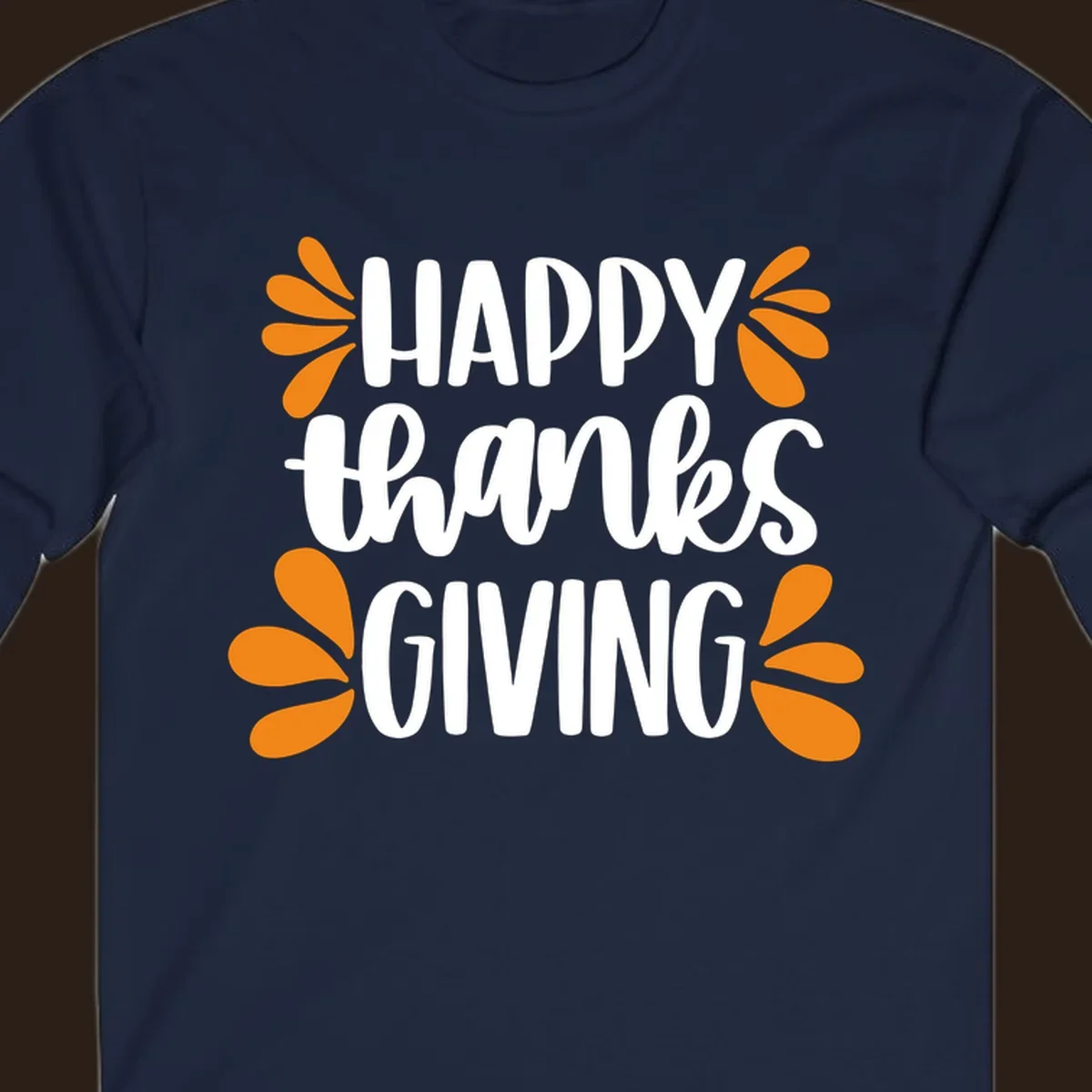 Happy Thanksgiving text with orange leaf accents, typography design.