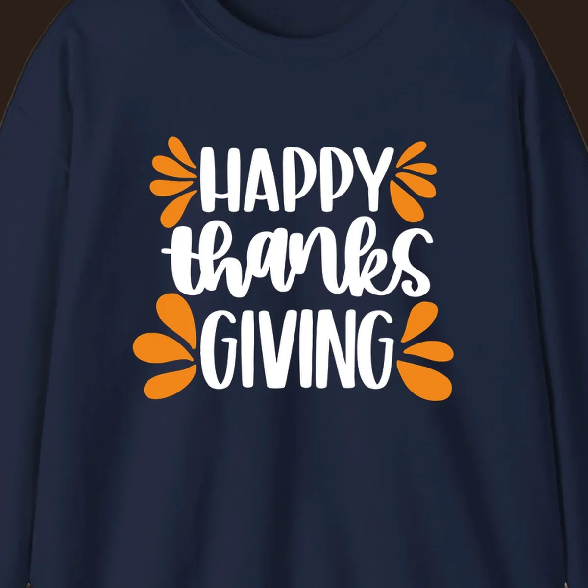 Happy Thanksgiving text with orange leaf accents, typography design.
