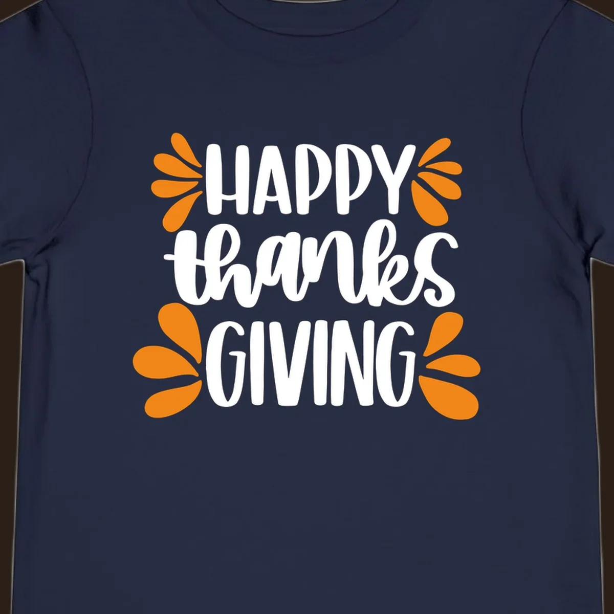 Happy Thanksgiving text with orange leaf accents, typography design.