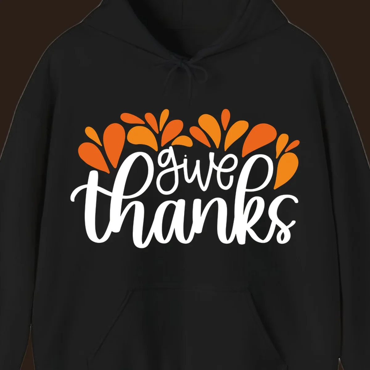 give thanks leaves design with white script text and orange leaf shapes