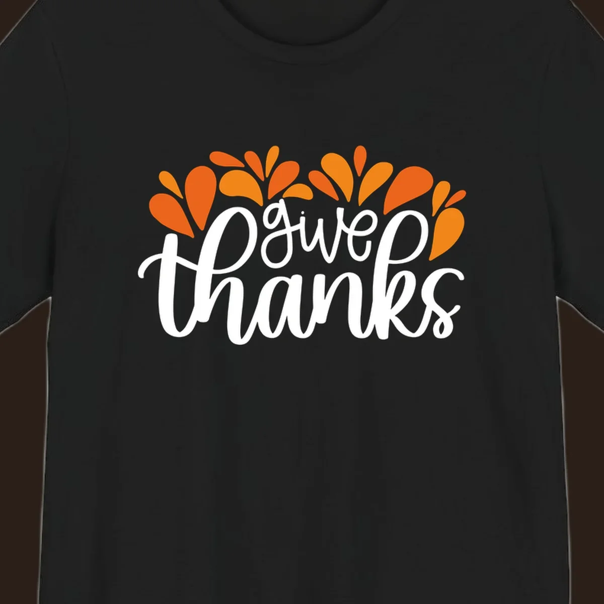 give thanks leaves design with white script text and orange leaf shapes