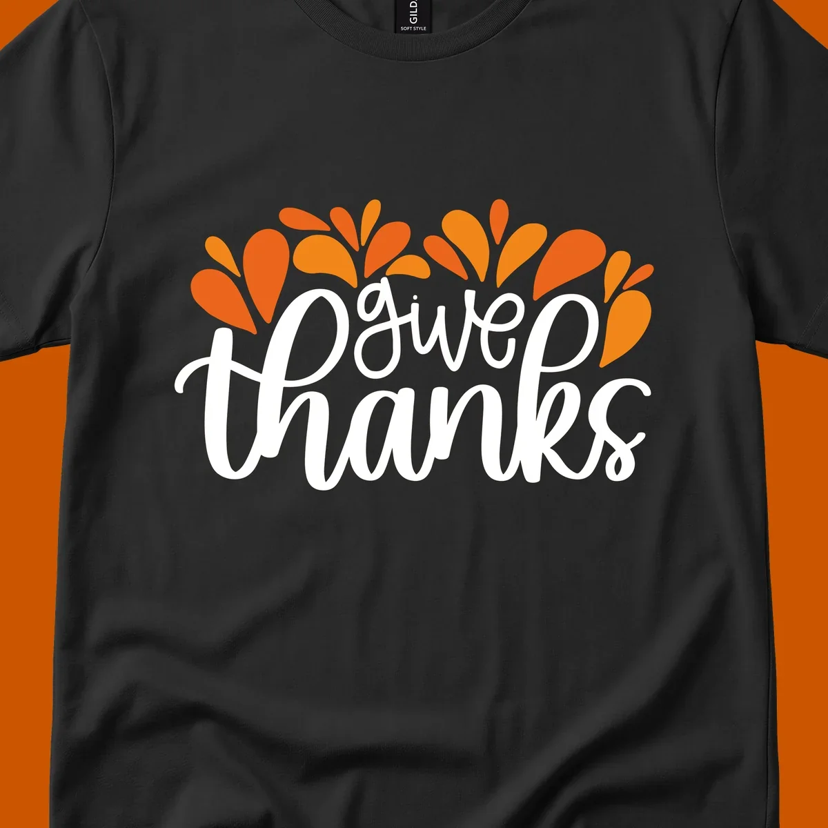 give thanks leaves design with white script text and orange leaf shapes