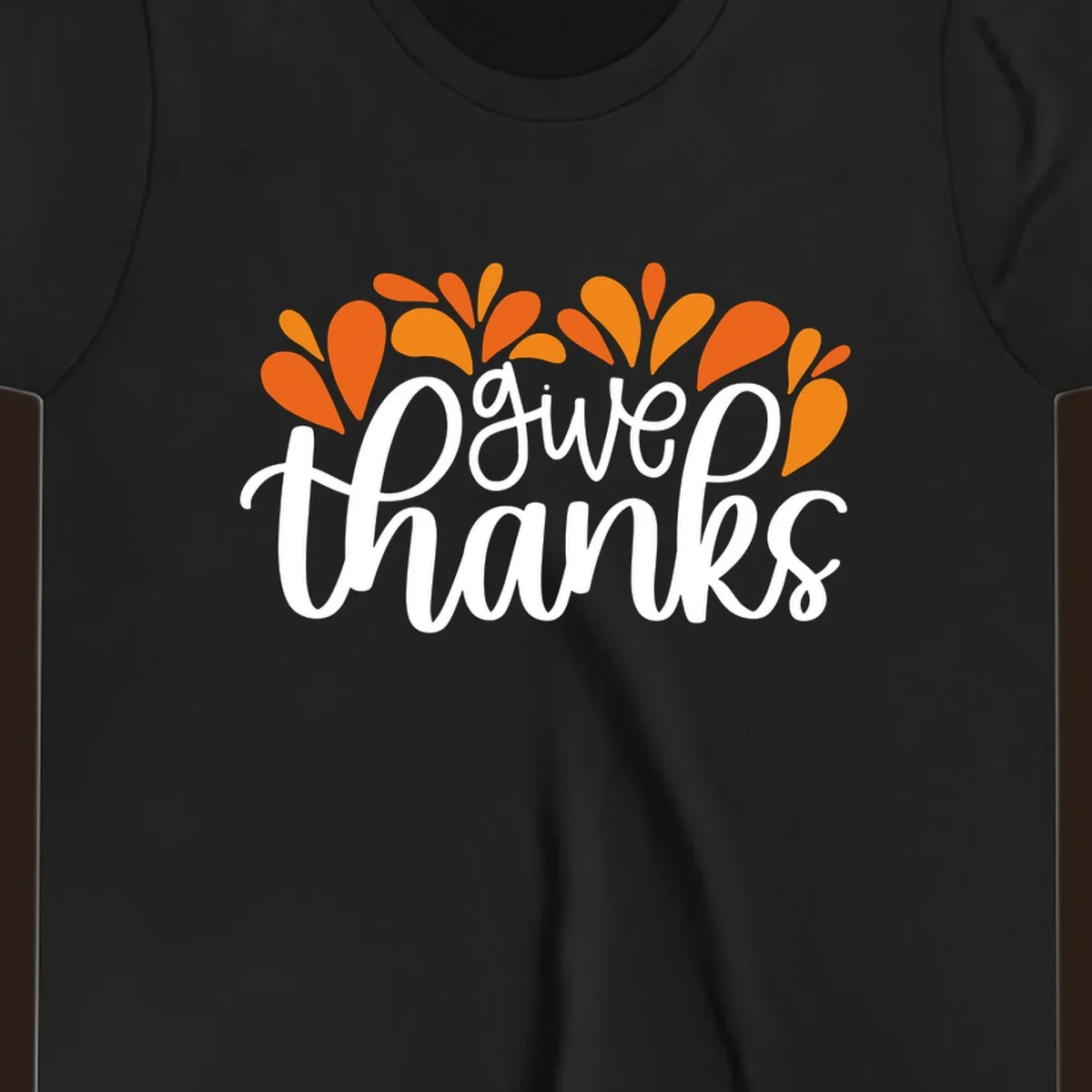 give thanks leaves design with white script text and orange leaf shapes