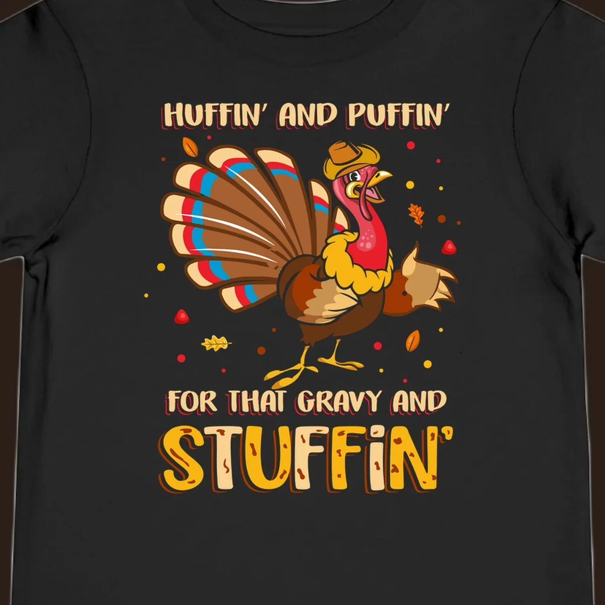 Cartoon turkey with fanned feathers and text 'Huffin And Puffin For Gravy Stuffin'
