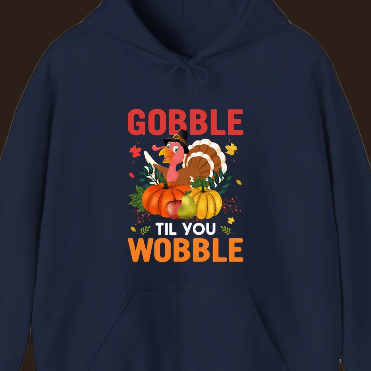 Gobble Til You Wobble Thanksgiving turkey illustration with pumpkins and text.