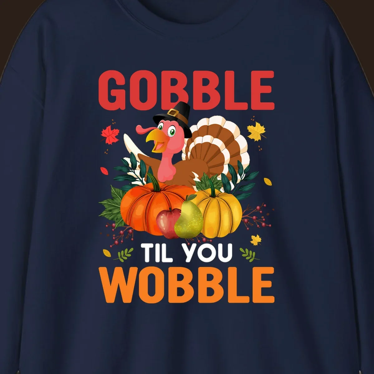 Gobble Til You Wobble Thanksgiving turkey illustration with pumpkins and text.