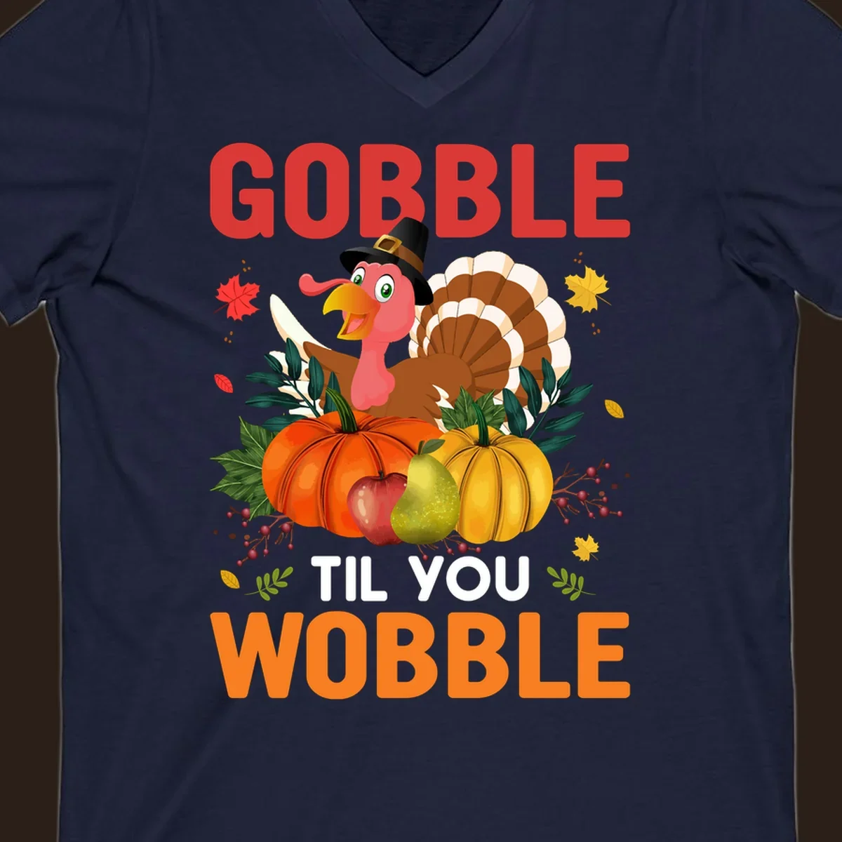 Gobble Til You Wobble Thanksgiving turkey illustration with pumpkins and text.
