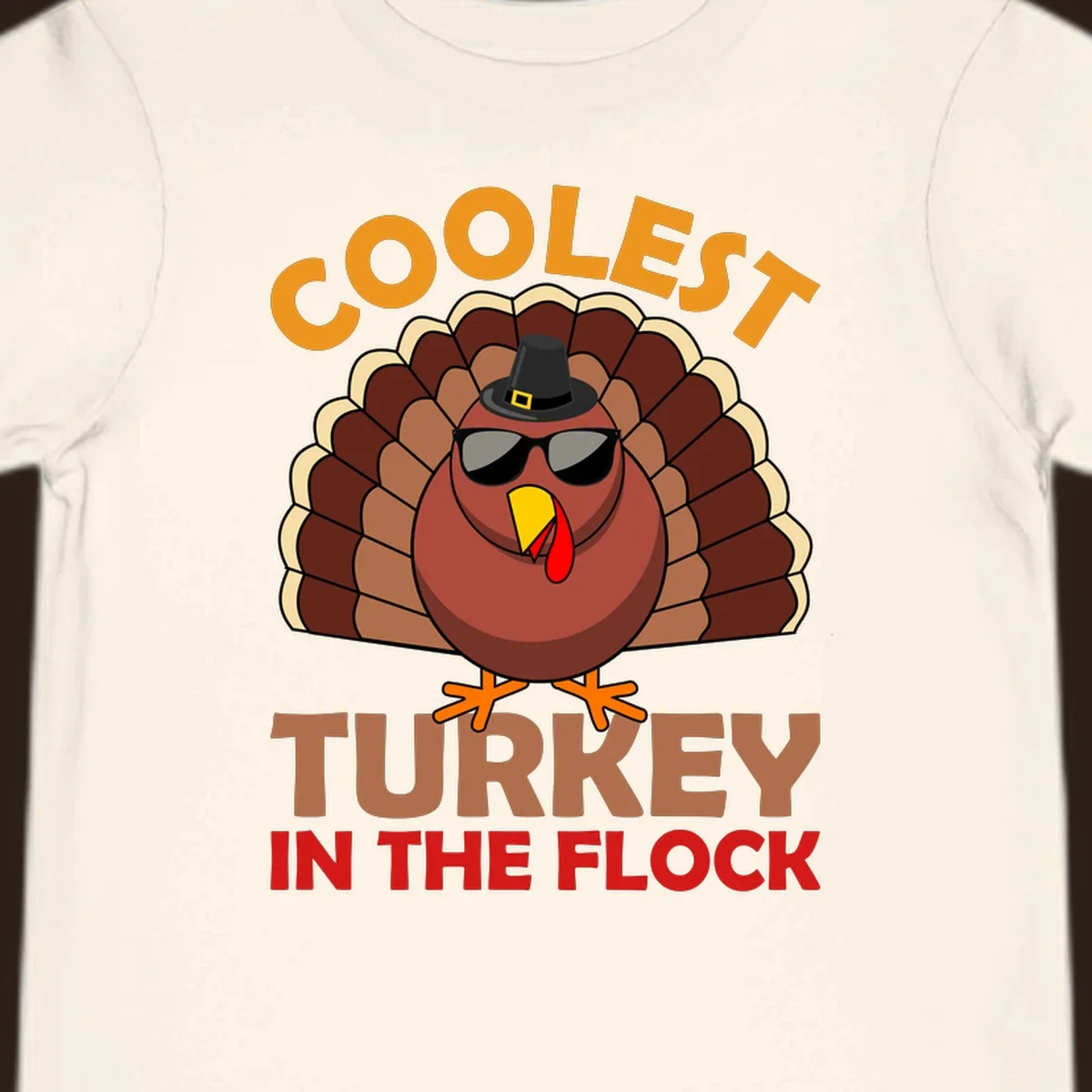 Coolest turkey in the flock Thanksgiving illustration with a turkey wearing sunglasses and a hat.