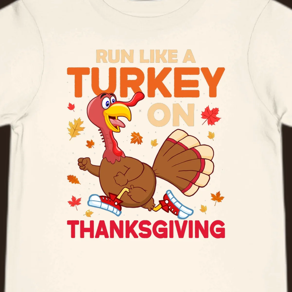 Cartoon turkey running with text Run Like A Turkey On Thanksgiving, autumn leaves and snowflakes.
