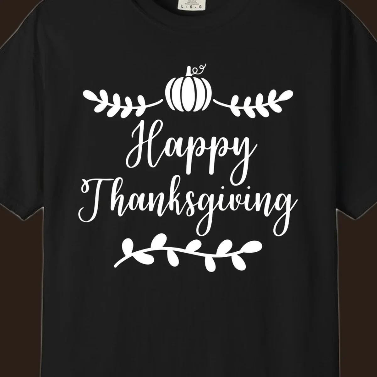 Happy Thanksgiving script text with pumpkin and leaves graphic