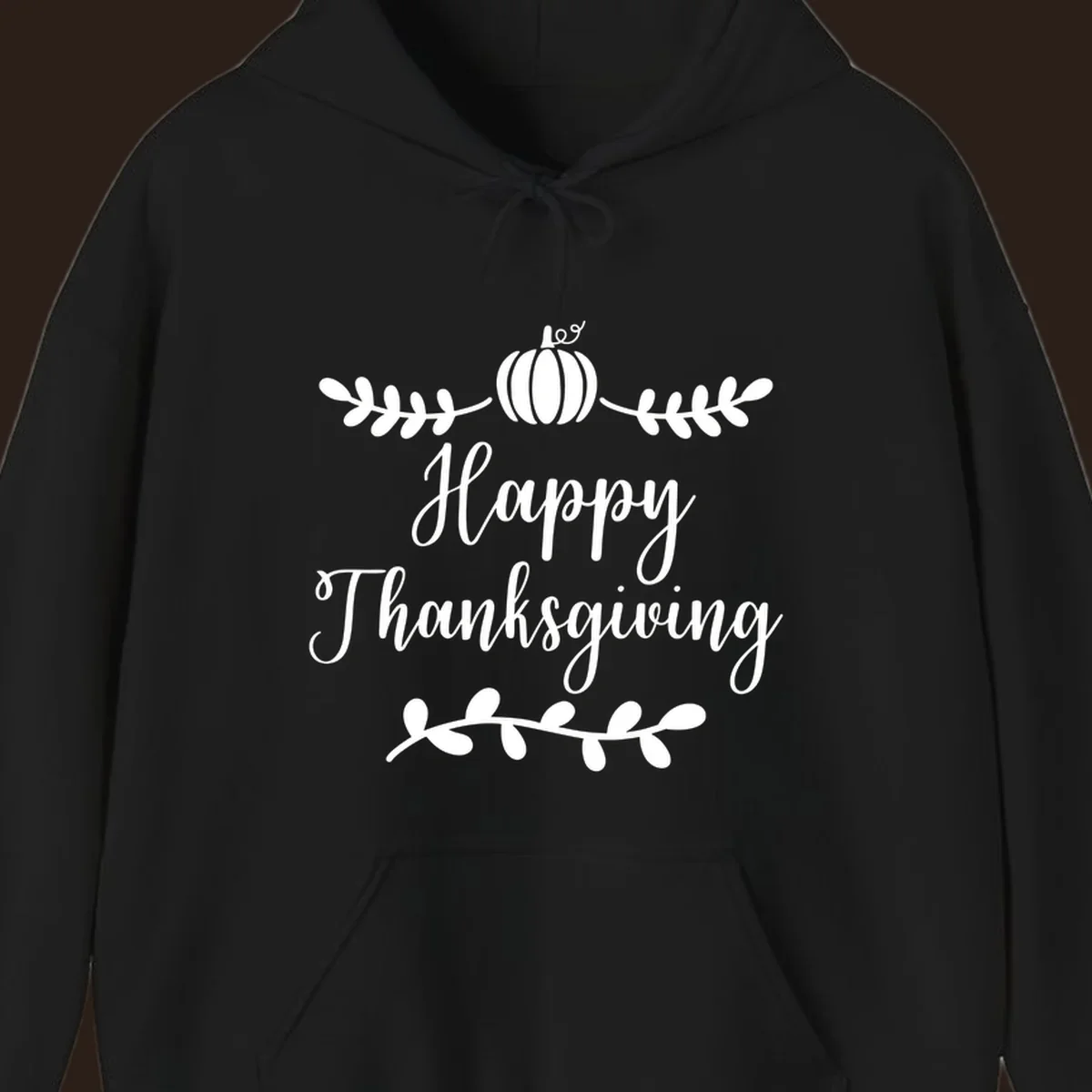 Happy Thanksgiving script text with pumpkin and leaves graphic