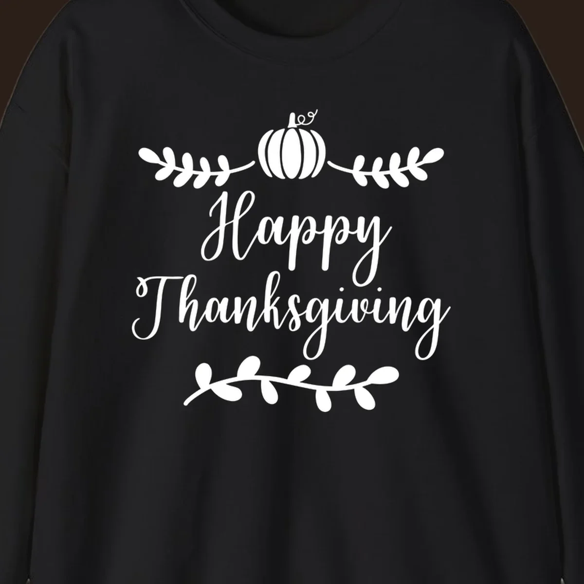 Happy Thanksgiving script text with pumpkin and leaves graphic