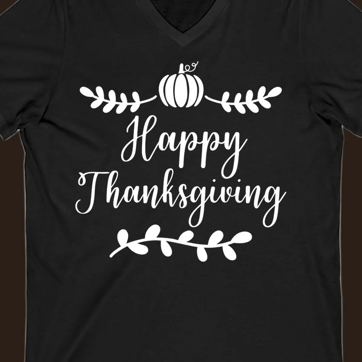 Happy Thanksgiving script text with pumpkin and leaves graphic