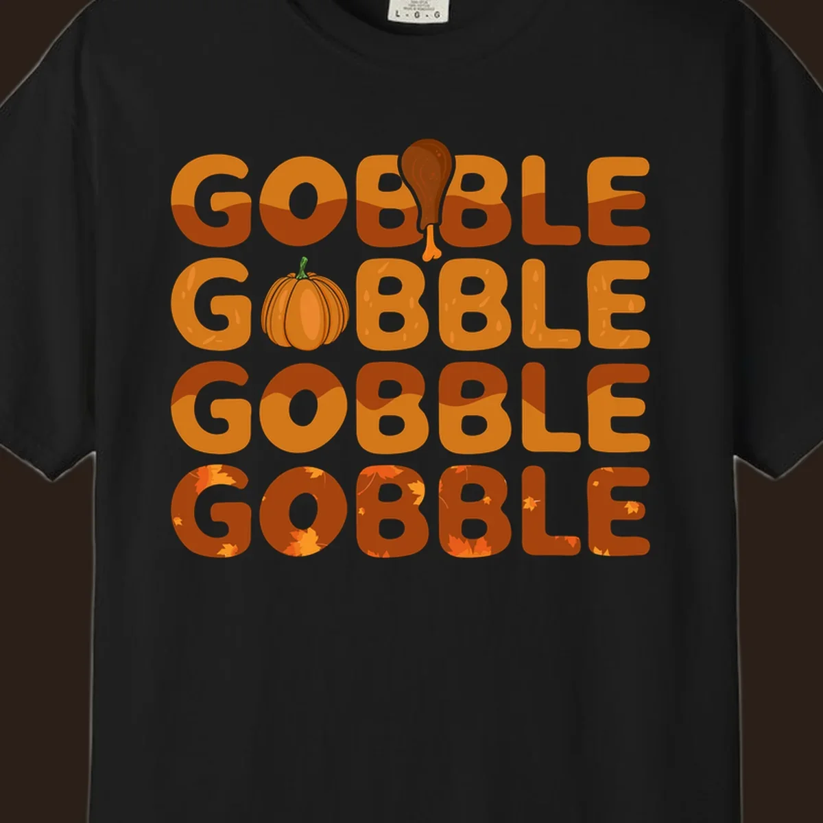 Gobble Gobble Thanksgiving text with pumpkin and turkey leg graphic