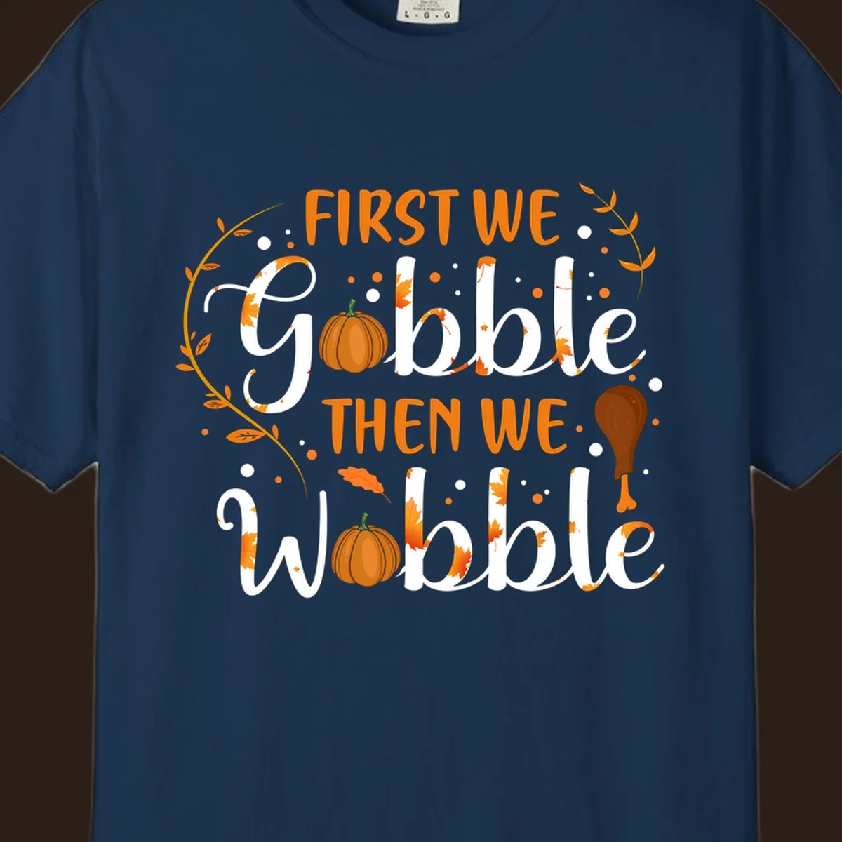 First we gobble then we wobble thanksgiving design with pumpkins and fall leaves.