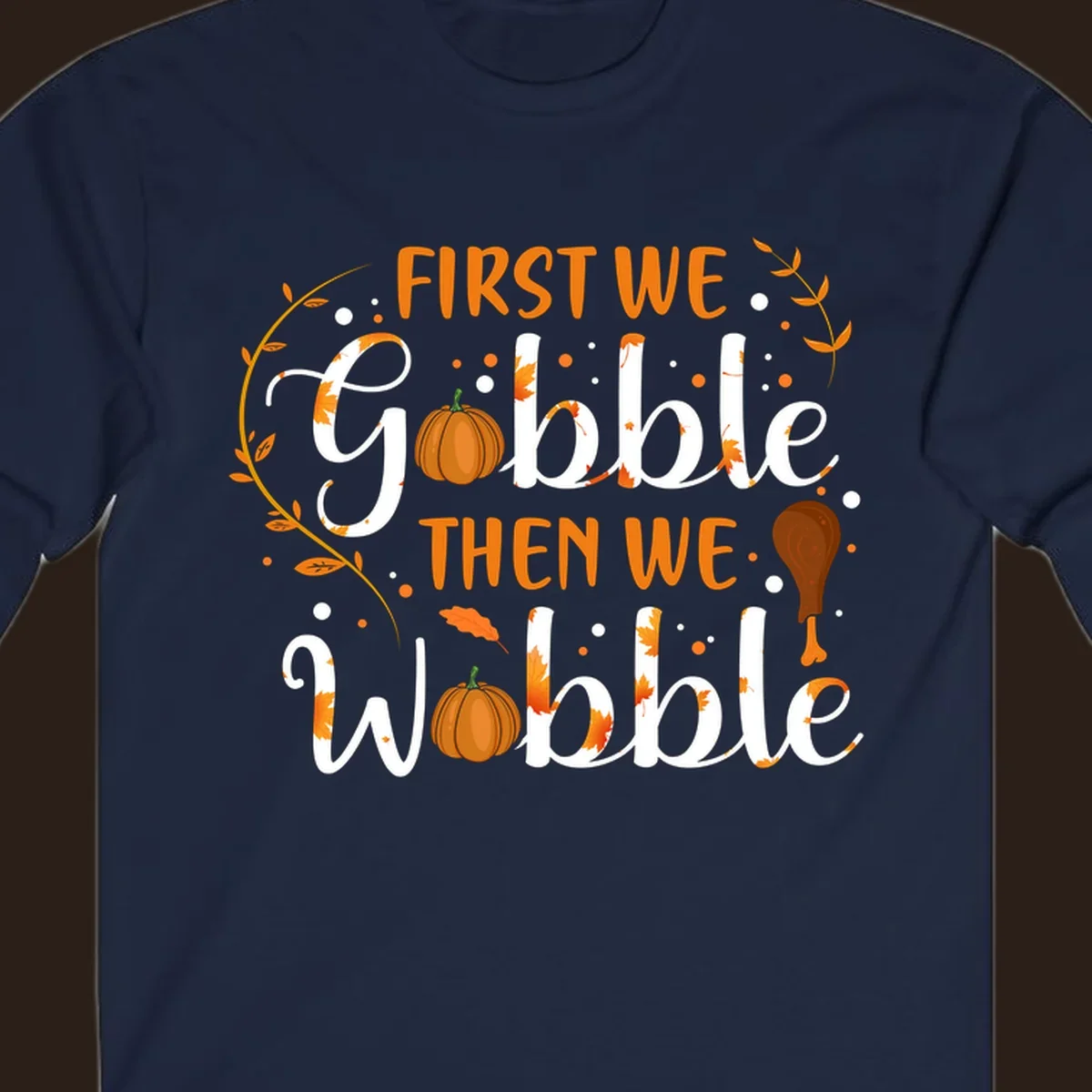 First we gobble then we wobble thanksgiving design with pumpkins and fall leaves.