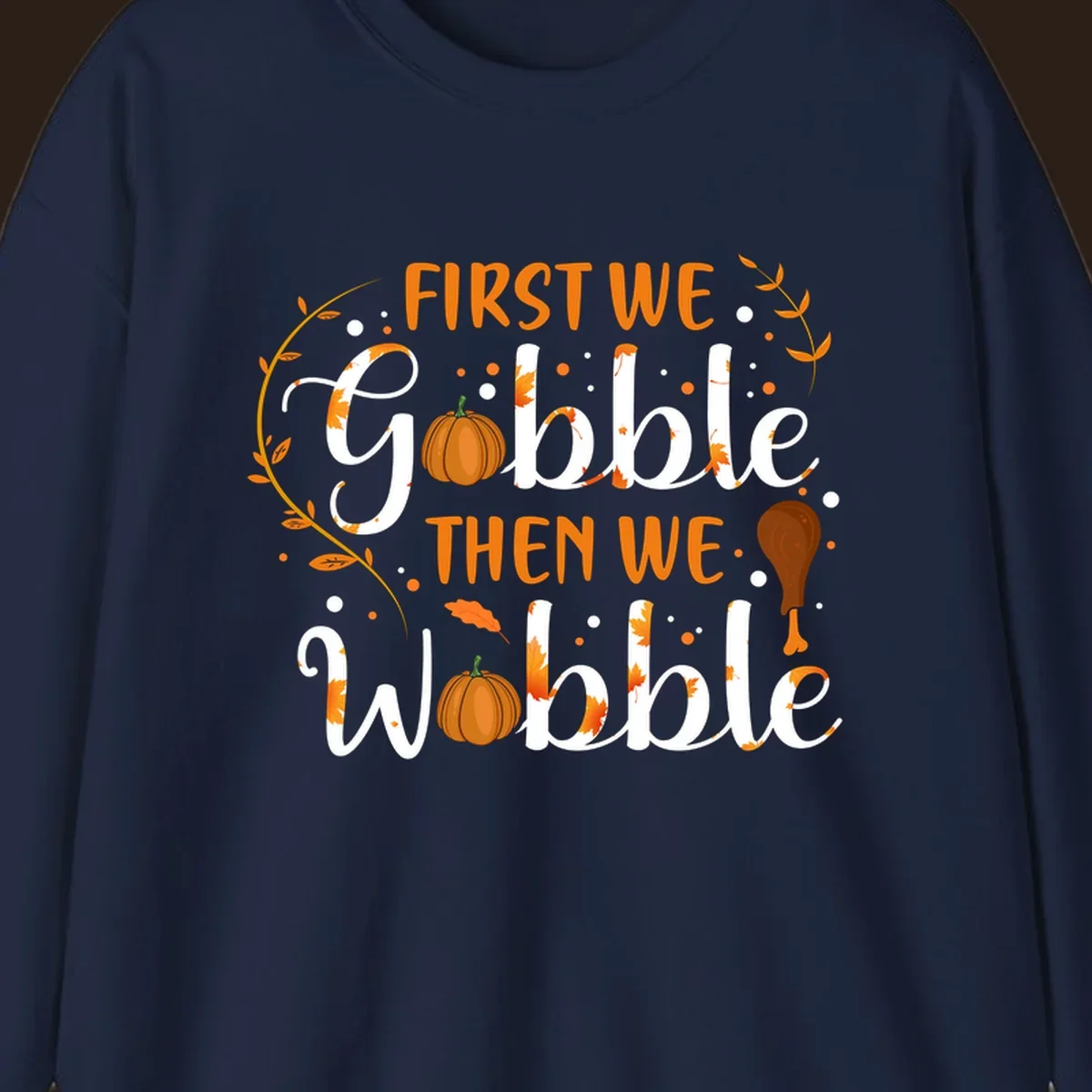 First we gobble then we wobble thanksgiving design with pumpkins and fall leaves.
