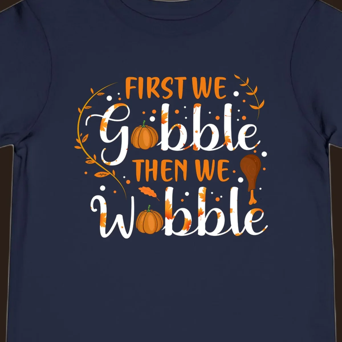 First we gobble then we wobble thanksgiving design with pumpkins and fall leaves.