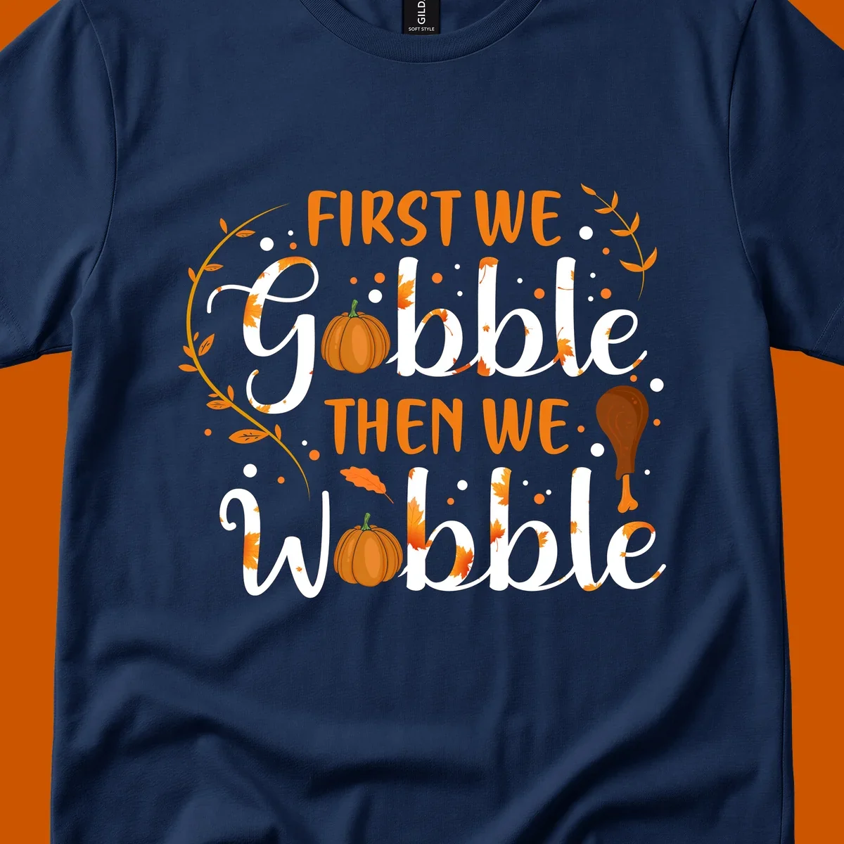 First we gobble then we wobble thanksgiving design with pumpkins and fall leaves.