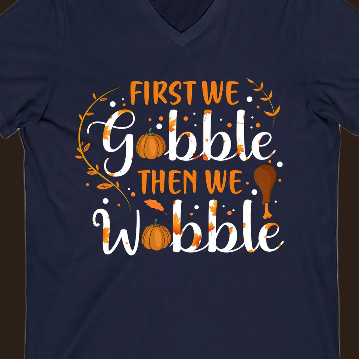 First we gobble then we wobble thanksgiving design with pumpkins and fall leaves.