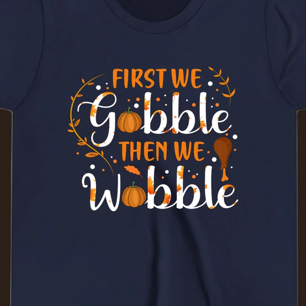 First we gobble then we wobble thanksgiving design with pumpkins and fall leaves.
