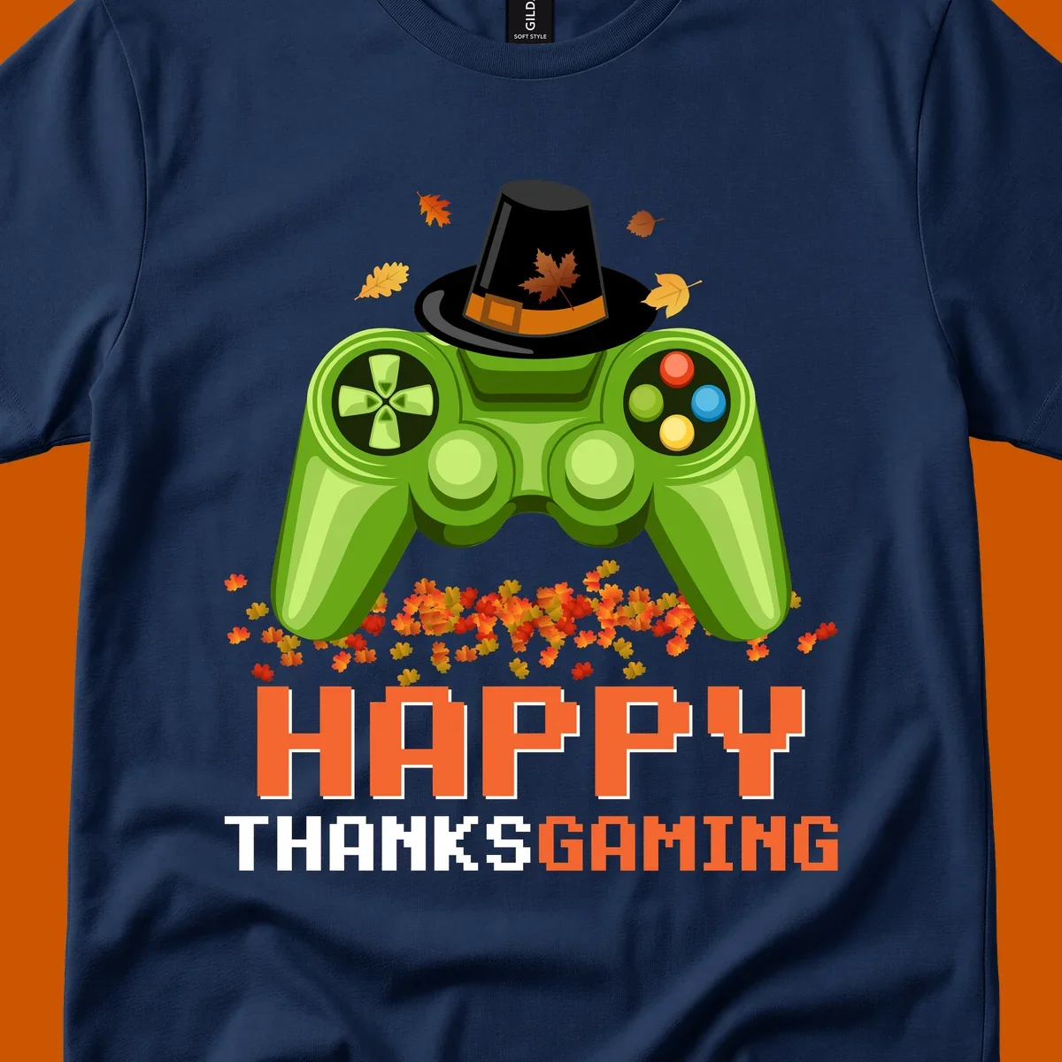 Happy Thanksgaming design with a video game controller, pilgrim hat, and fall leaves.