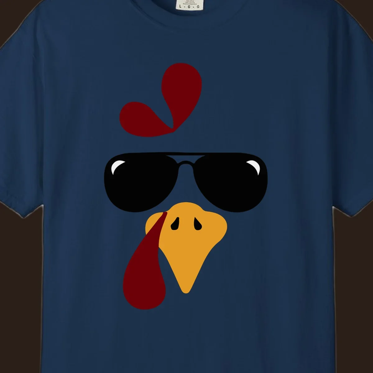 Cool turkey face wearing sunglasses graphic for Thanksgiving shirt.