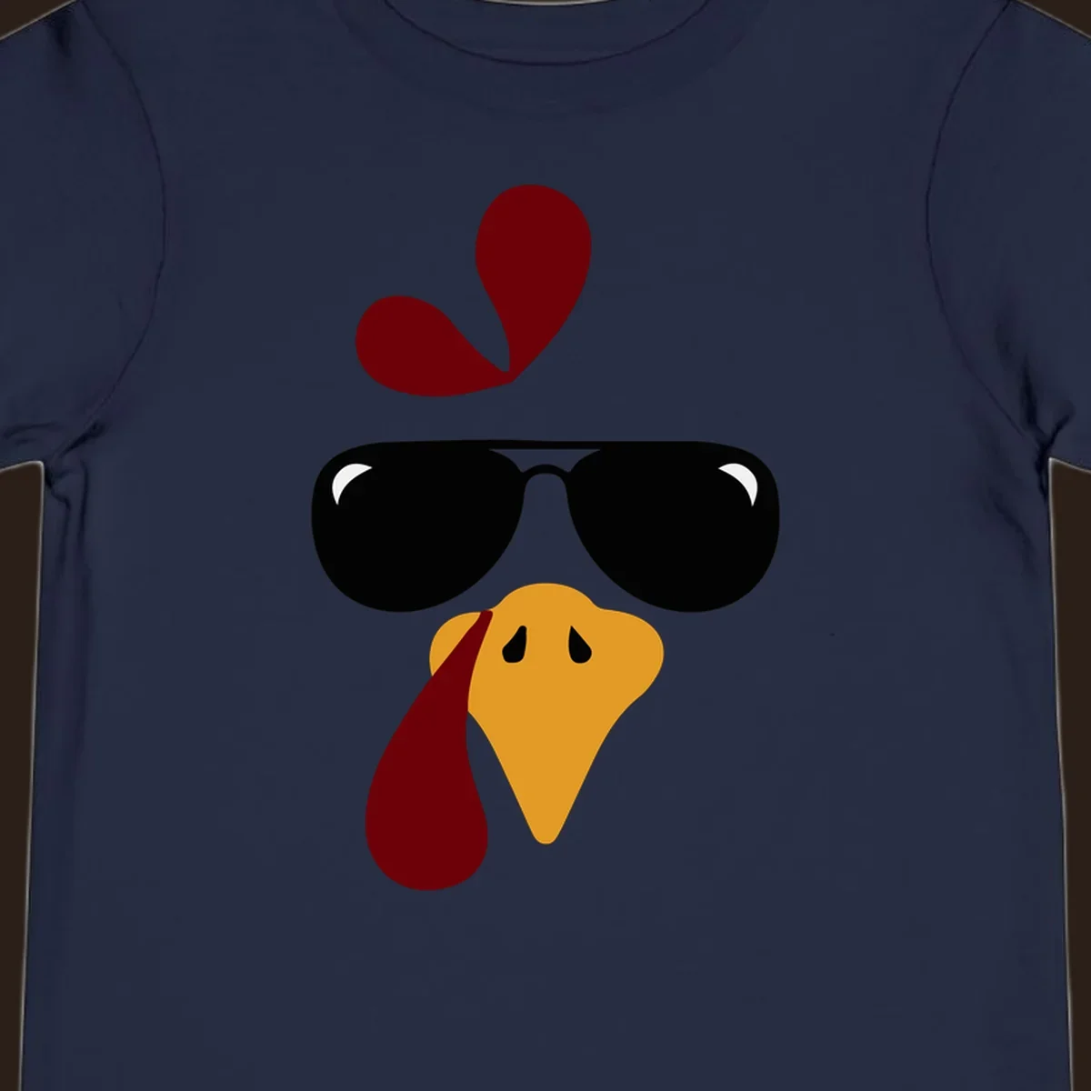 Cool turkey face wearing sunglasses graphic for Thanksgiving shirt.