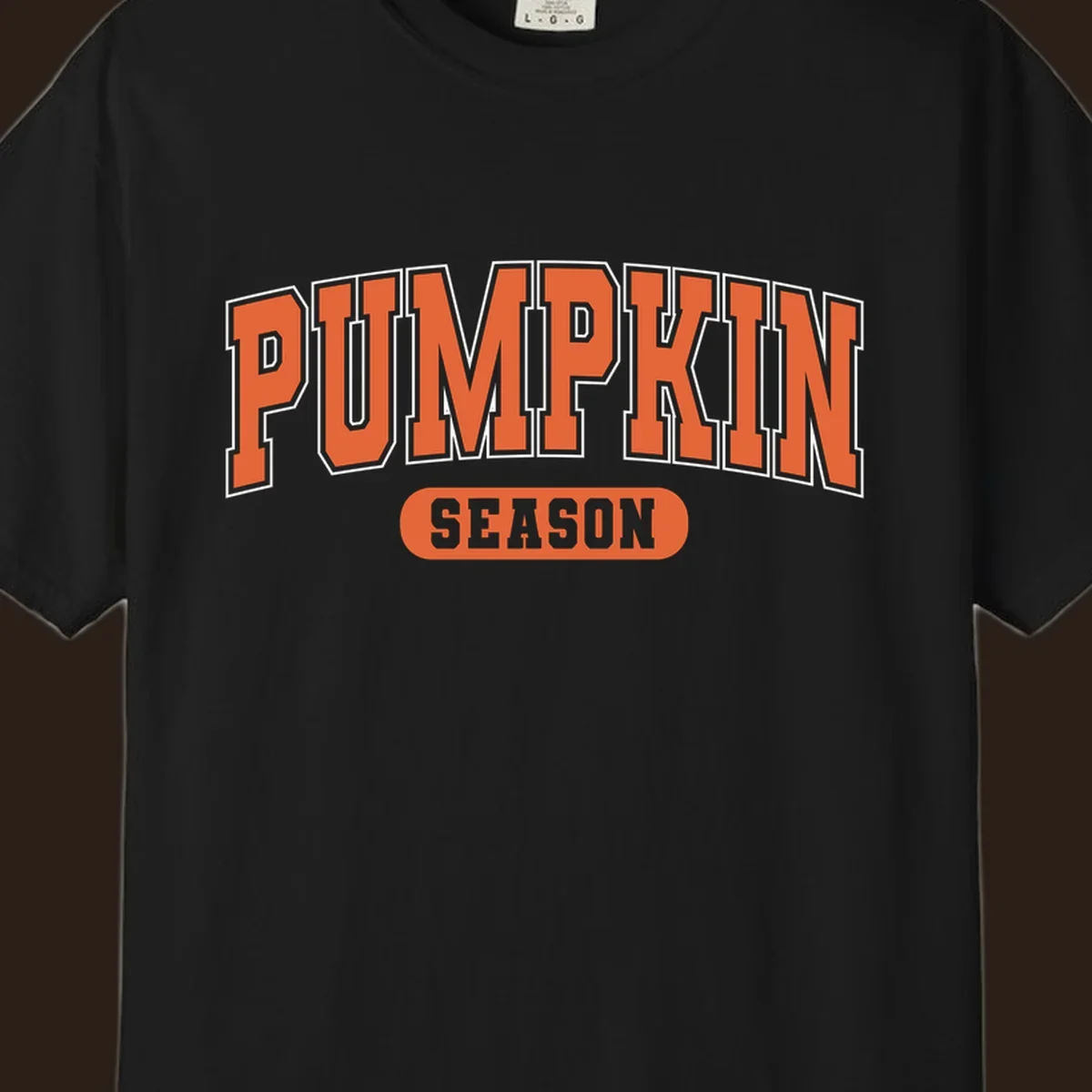 Pumpkin Season varsity text design in orange and white on black background.