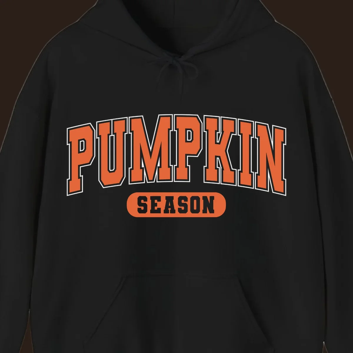 Pumpkin Season varsity text design in orange and white on black background.
