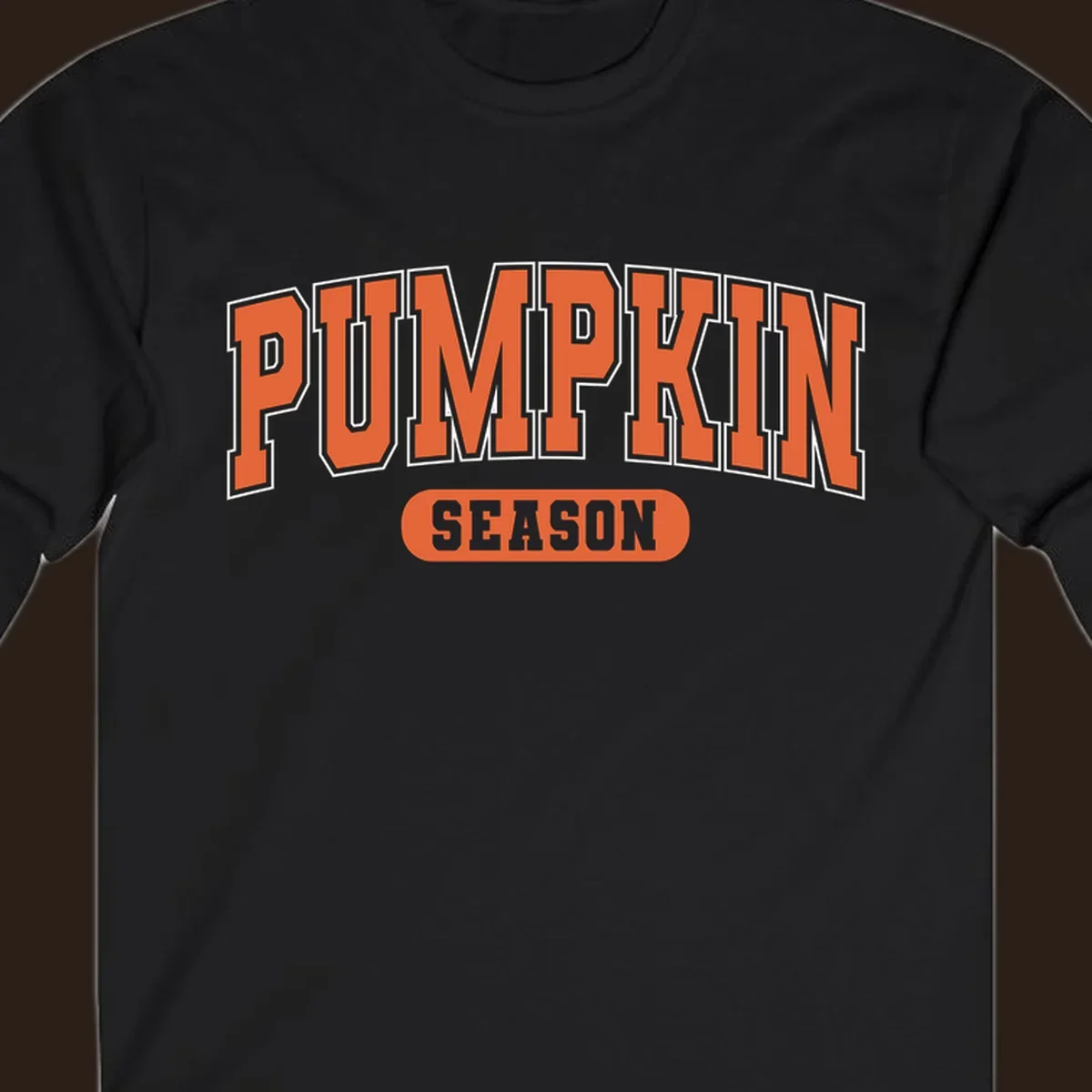 Pumpkin Season varsity text design in orange and white on black background.