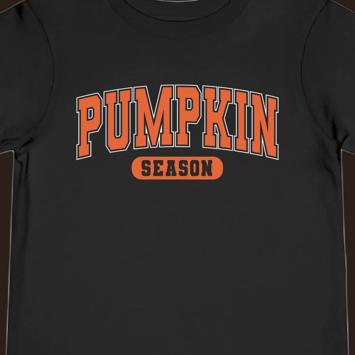 Pumpkin Season varsity text design in orange and white on black background.