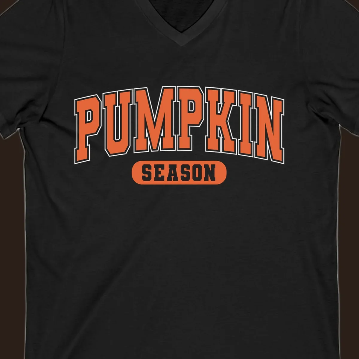 Pumpkin Season varsity text design in orange and white on black background.