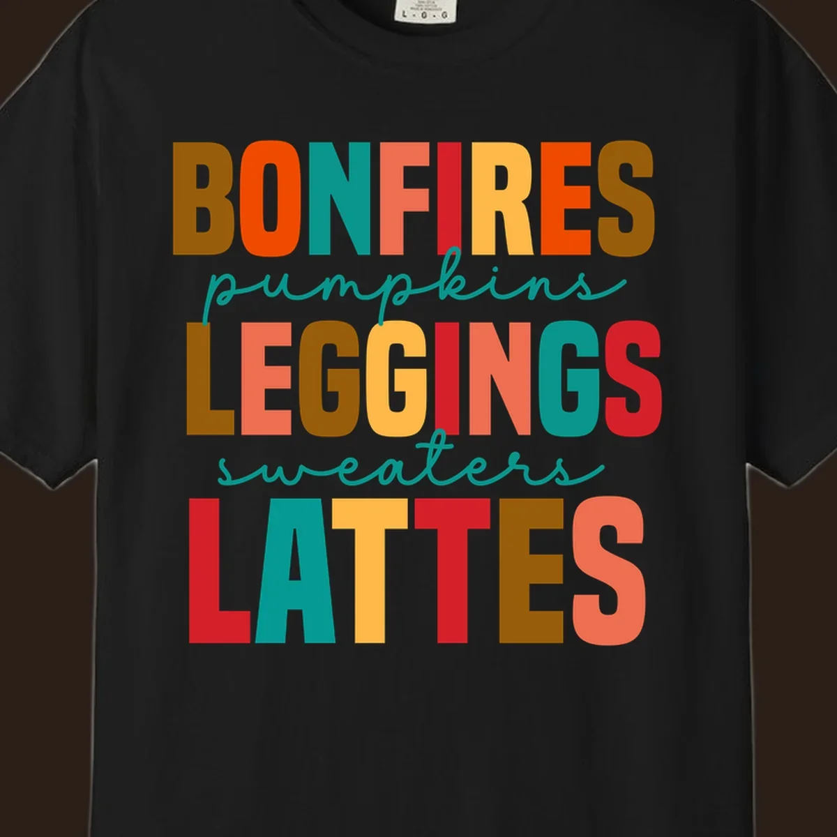 Fall vibes text design with words like Bonfires, Pumpkins, Leggings, Sweaters, Lattes in colorful block letters.