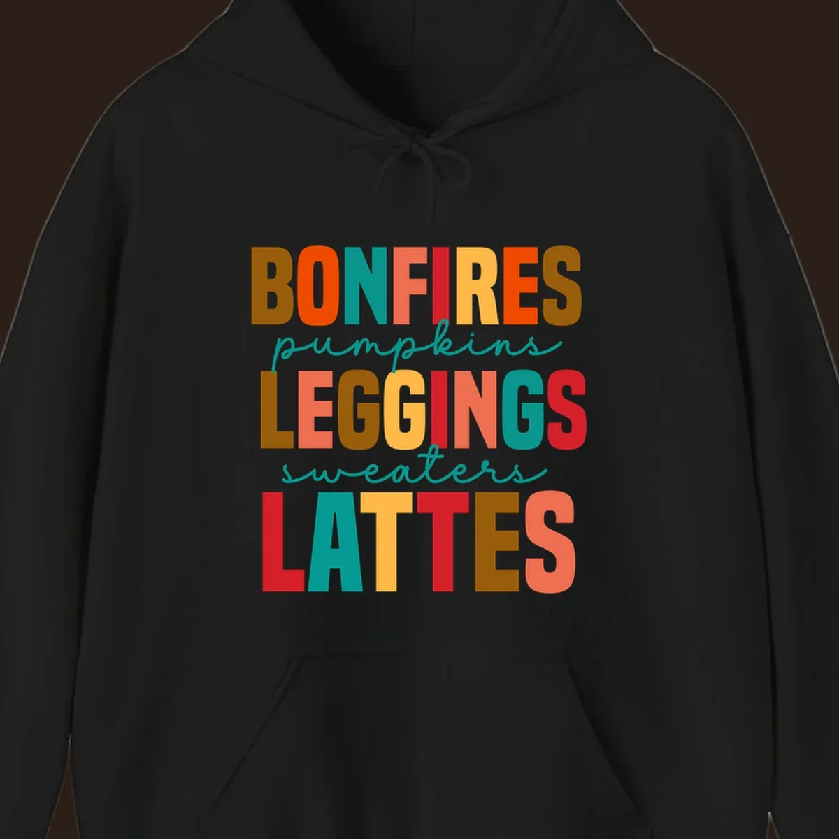 Fall vibes text design with words like Bonfires, Pumpkins, Leggings, Sweaters, Lattes in colorful block letters.