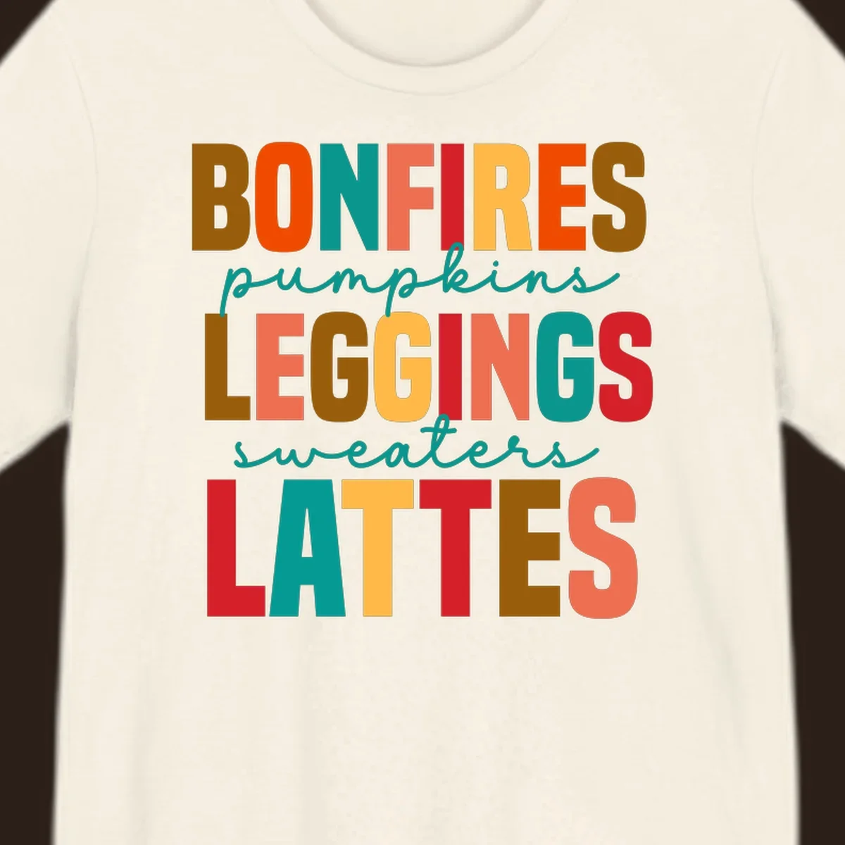 Fall vibes text design with words like Bonfires, Pumpkins, Leggings, Sweaters, Lattes in colorful block letters.