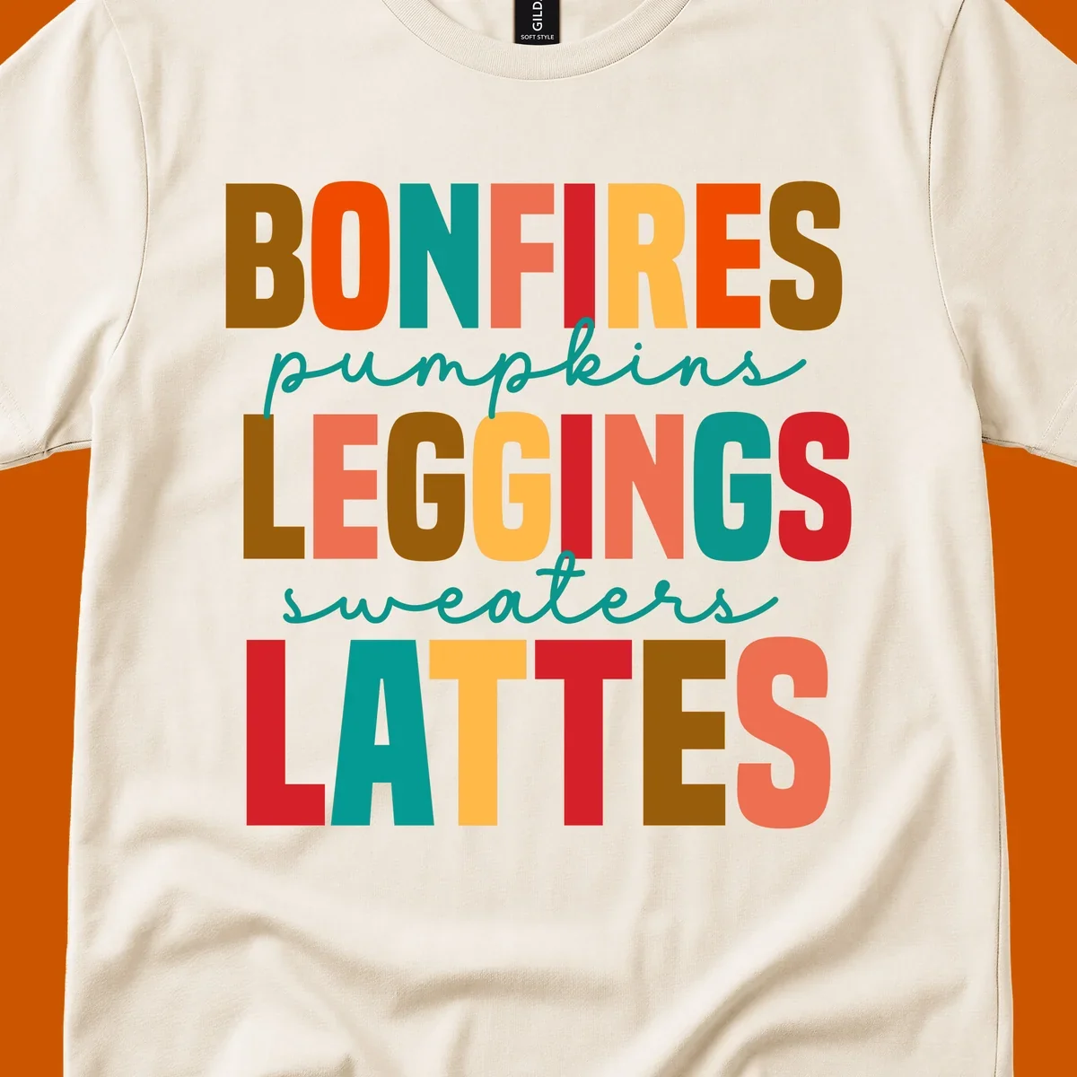 Fall vibes text design with words like Bonfires, Pumpkins, Leggings, Sweaters, Lattes in colorful block letters.