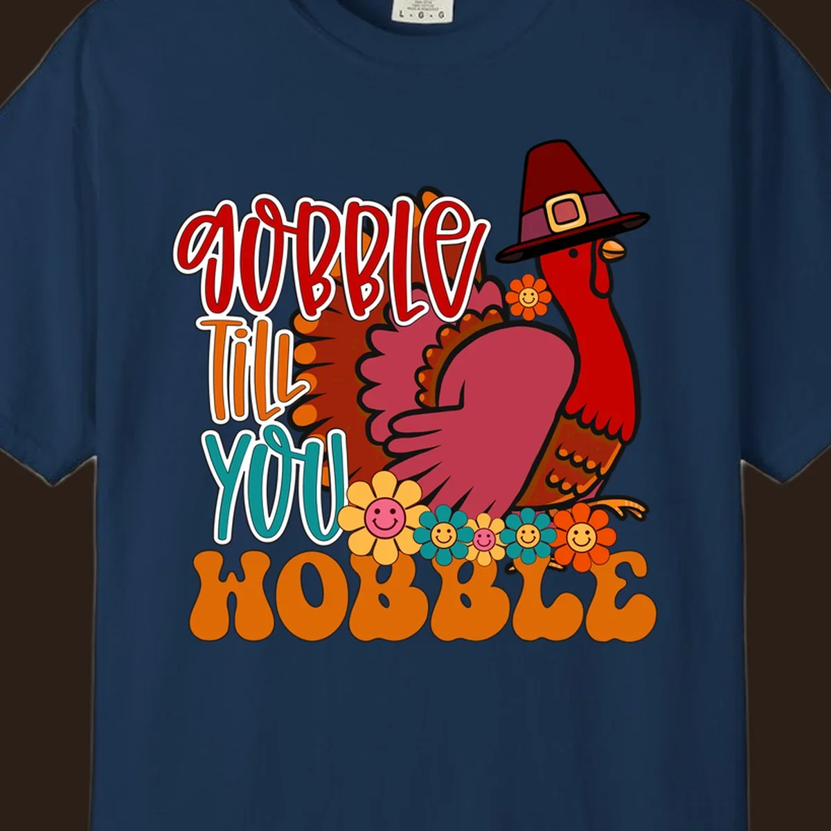 Gobble Till You Hobble Thanksgiving Turkey design with retro flowers and pilgrim hat.