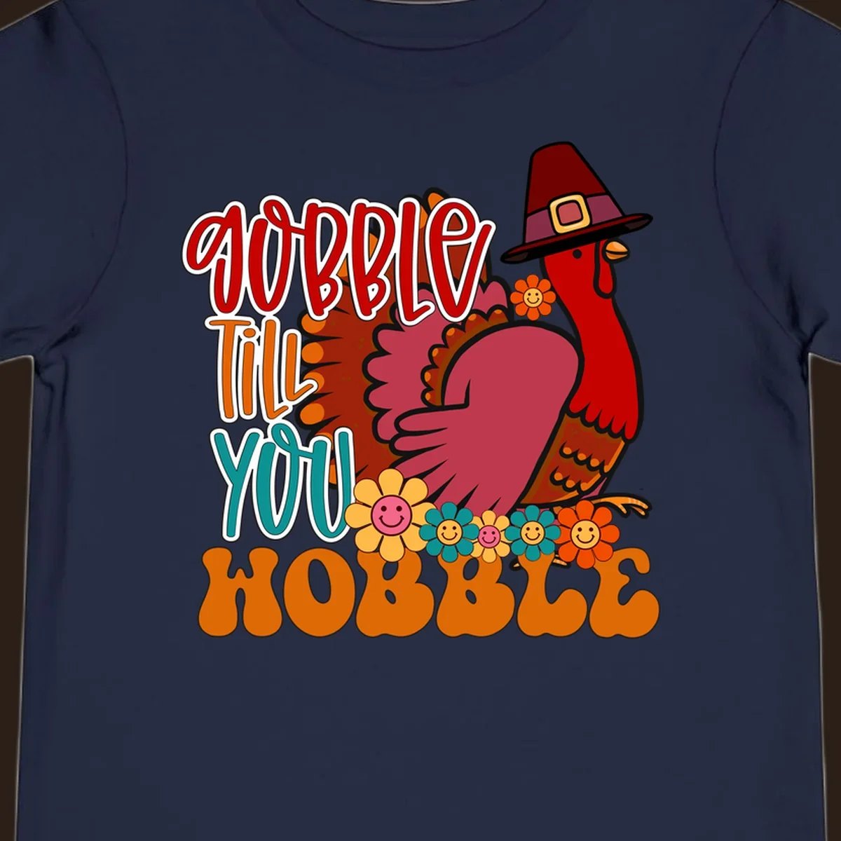 Gobble Till You Hobble Thanksgiving Turkey design with retro flowers and pilgrim hat.