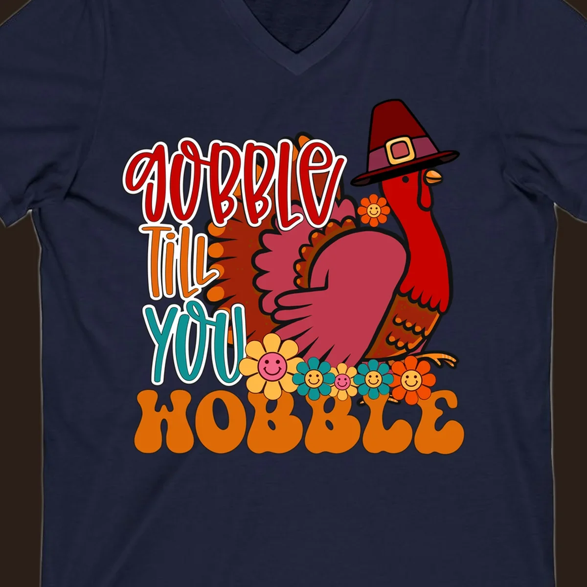 Gobble Till You Hobble Thanksgiving Turkey design with retro flowers and pilgrim hat.